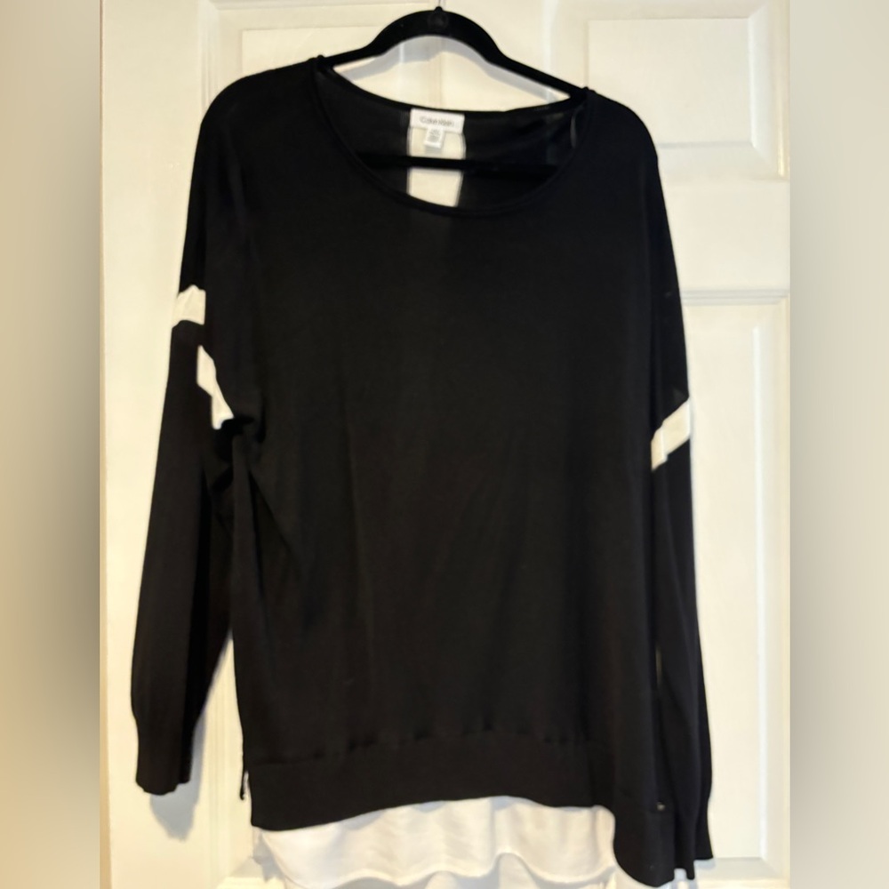 Woman’s knit top with blouse tail